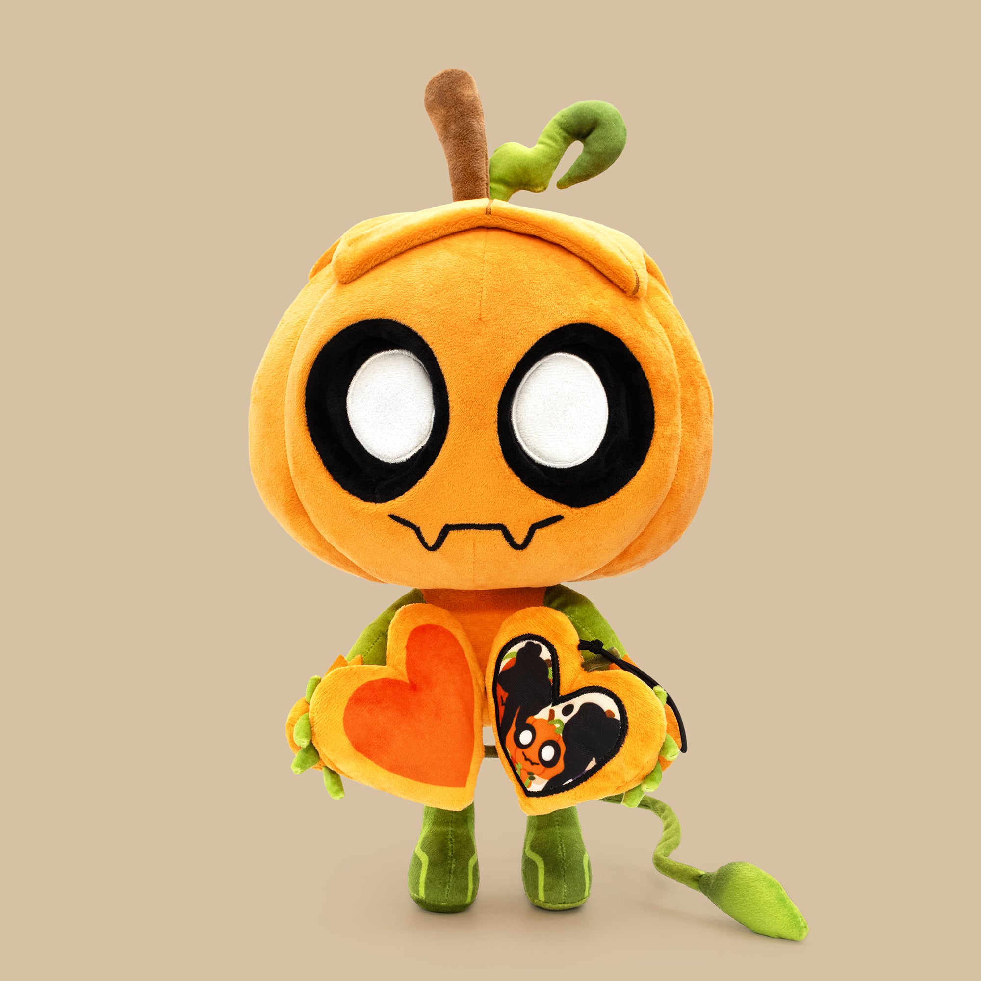 Plush toy with a pumpkin design on a beige background