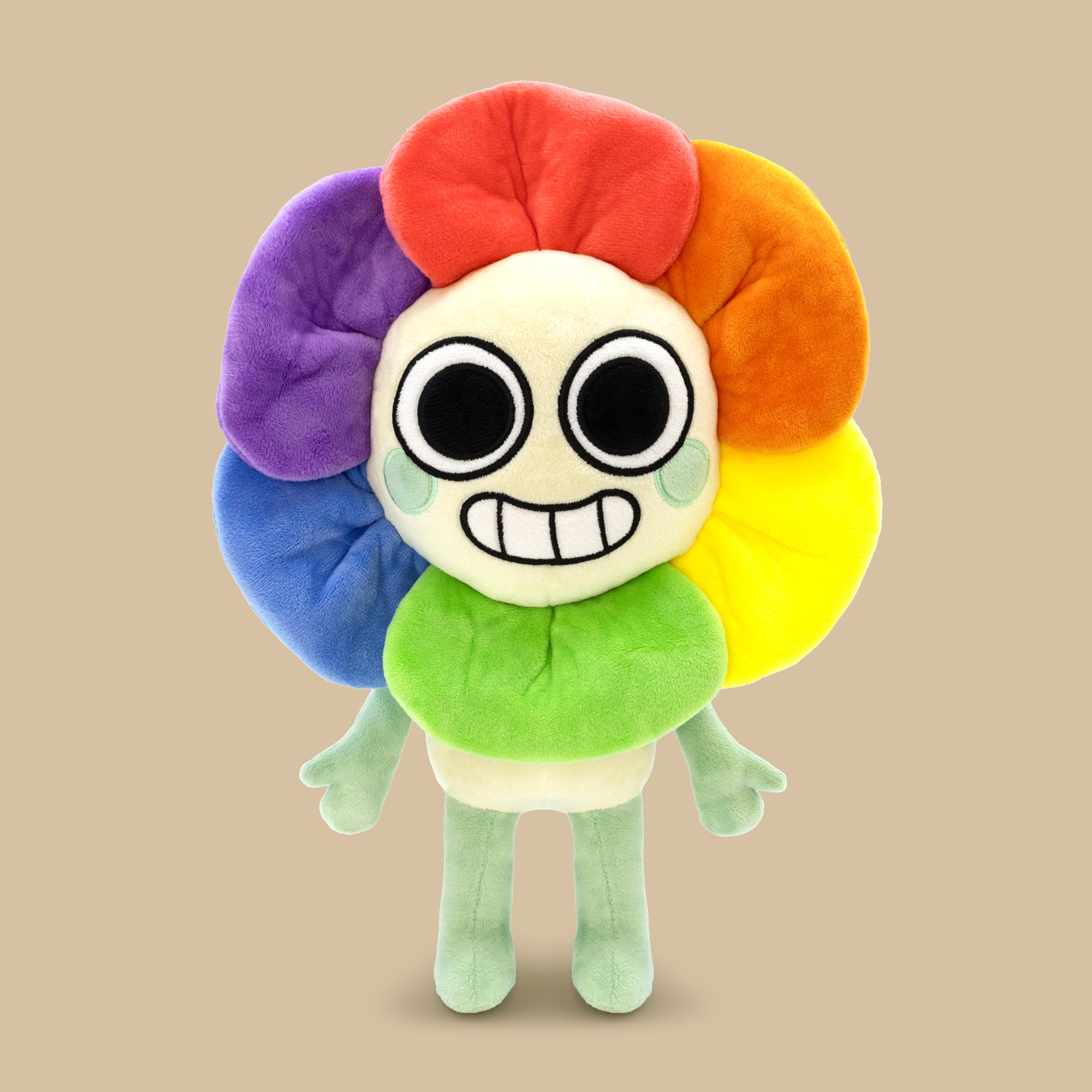 Colorful plush toy with a smiling face on a beige background
