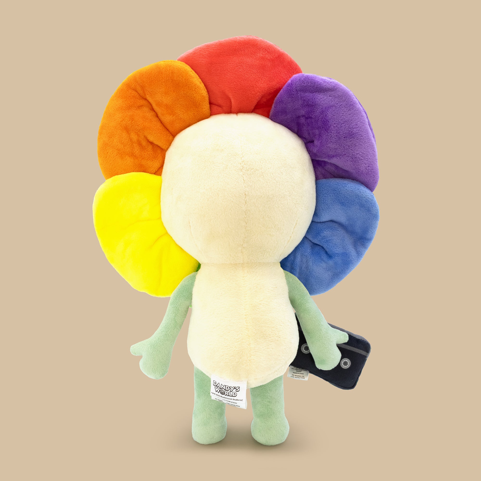 Plush toy with rainbow-colored head on a beige background
