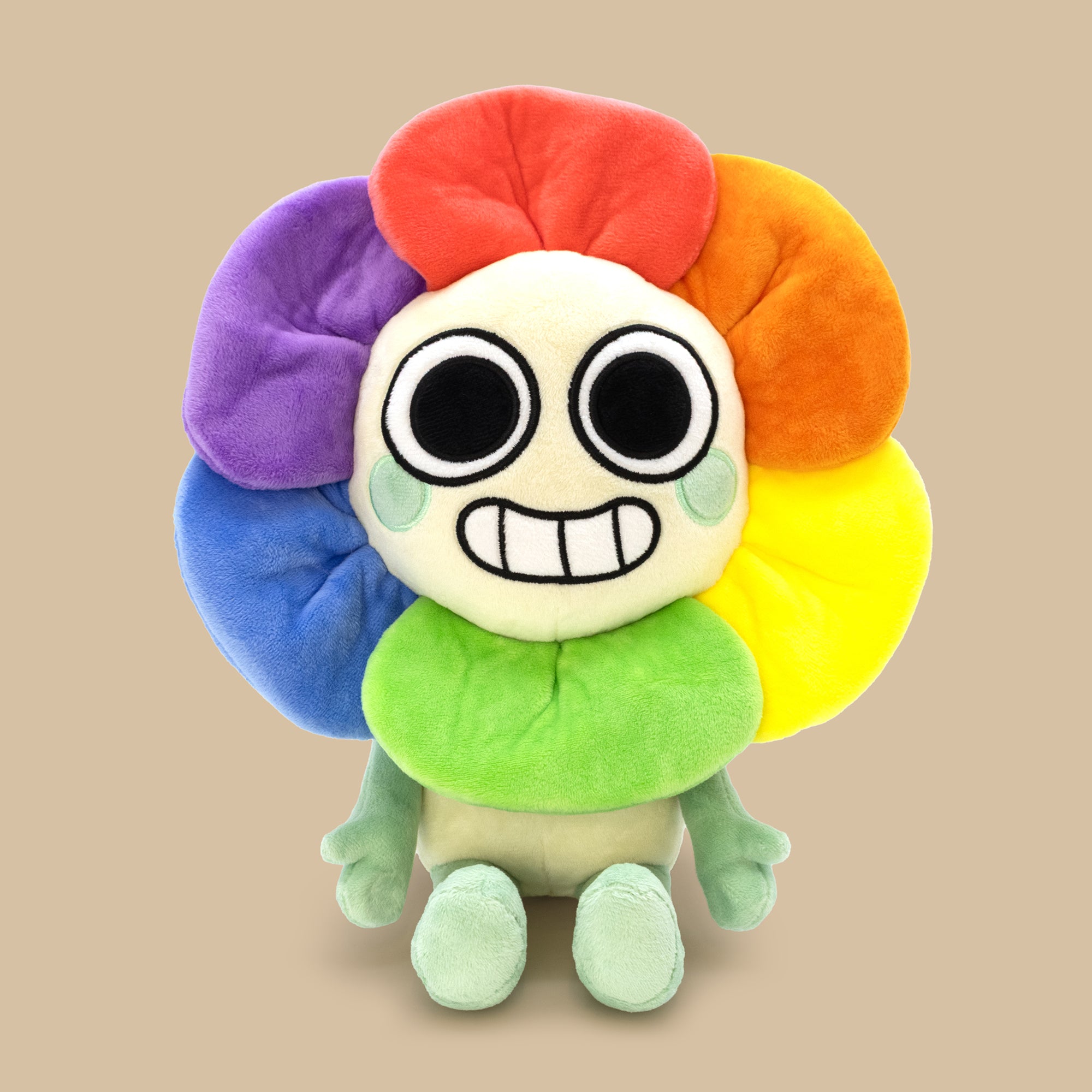 Colorful plush toy with a round body and flower-like segments on a beige background