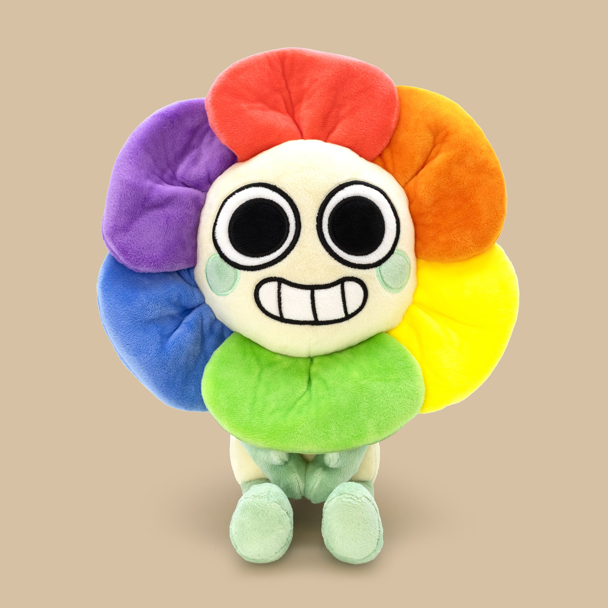 Colorful plush toy with a round body and flower-like design on a beige background