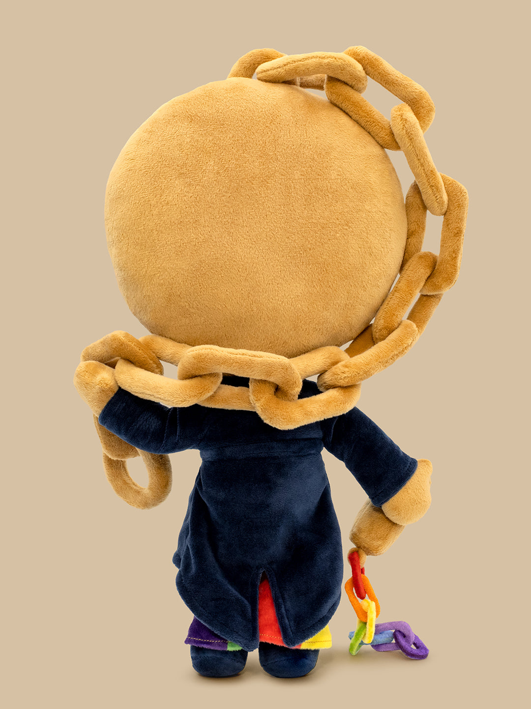 Plush toy showing back with long chains, on a beige background