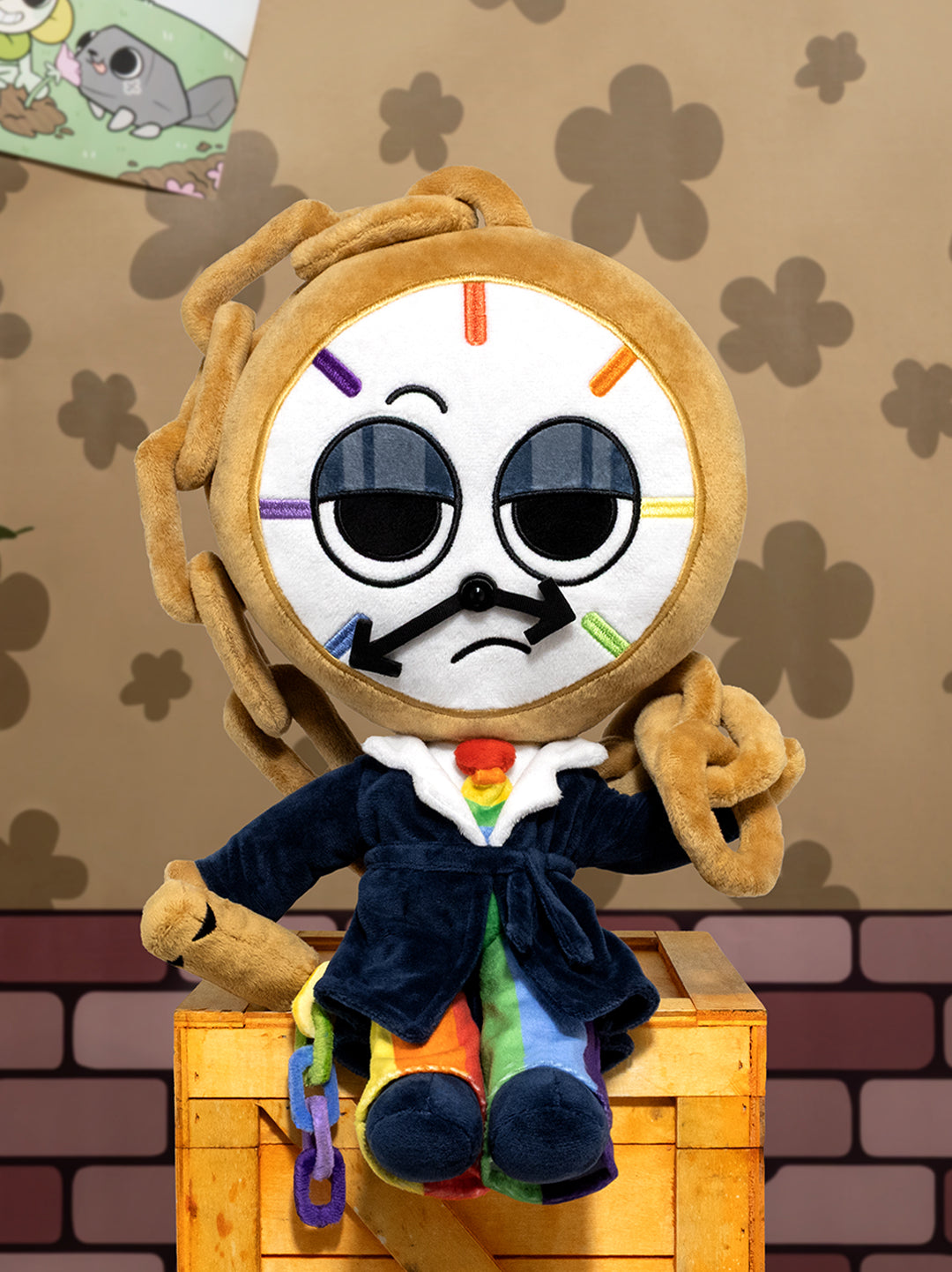 Plush toy resembling a character with a clock face on a wooden crate against a patterned wall.