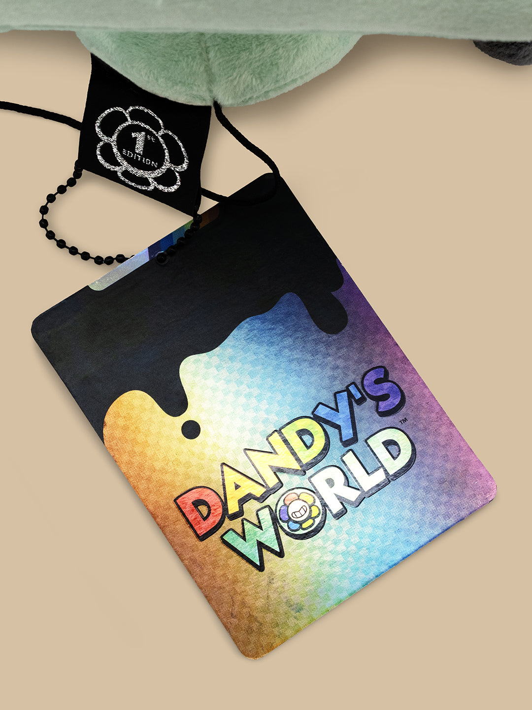 Colorful pouch with 'Dandy's World' branding on a beige surface