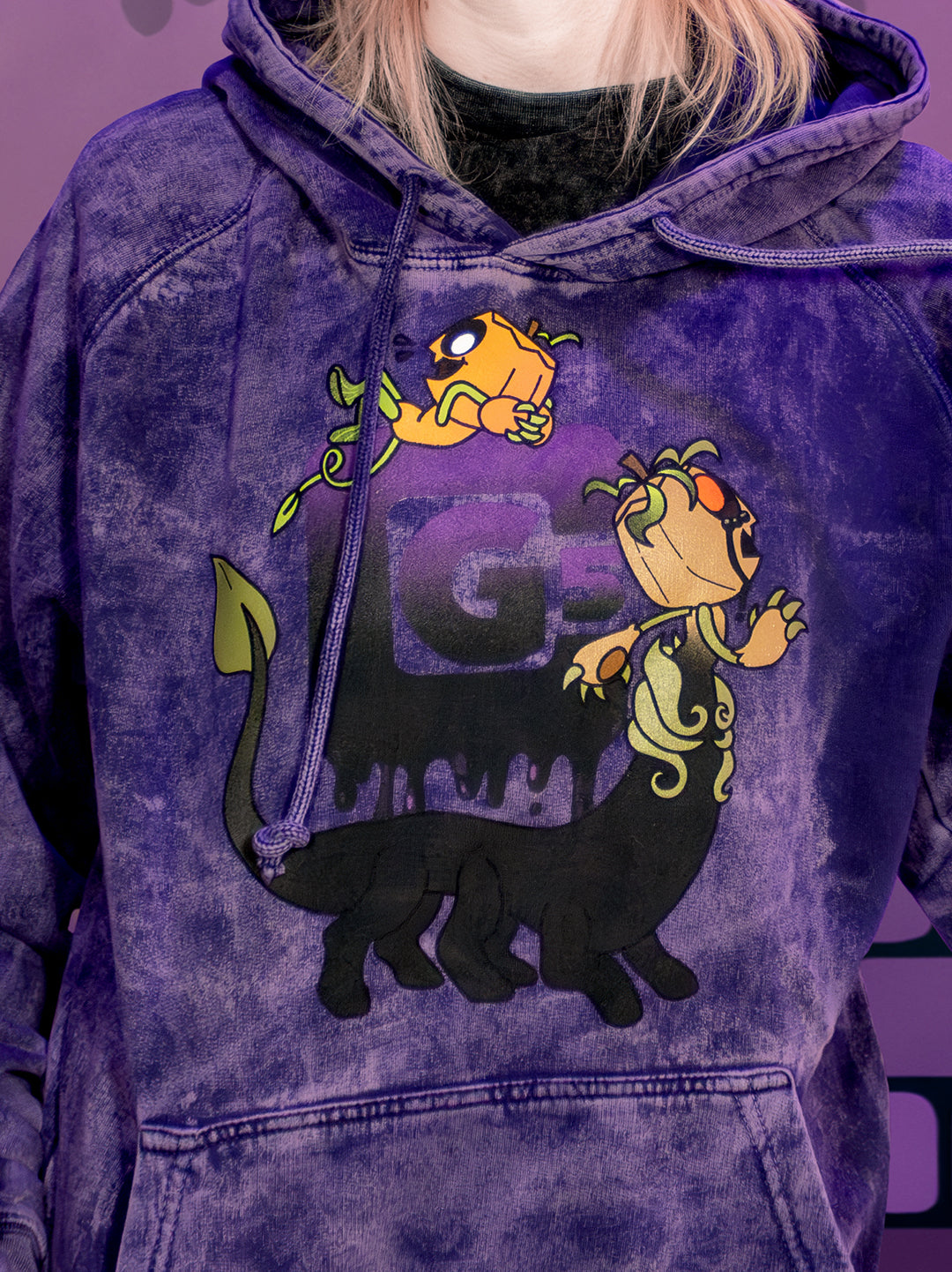Purple hoodie with cartoon characters on a purple background