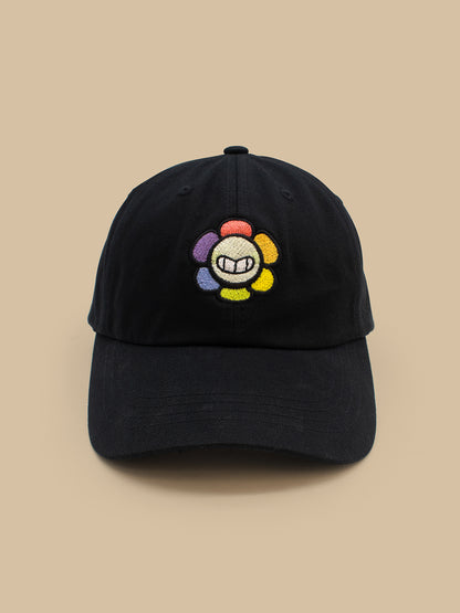 Black cap with a colorful embroidered logo on a beige background