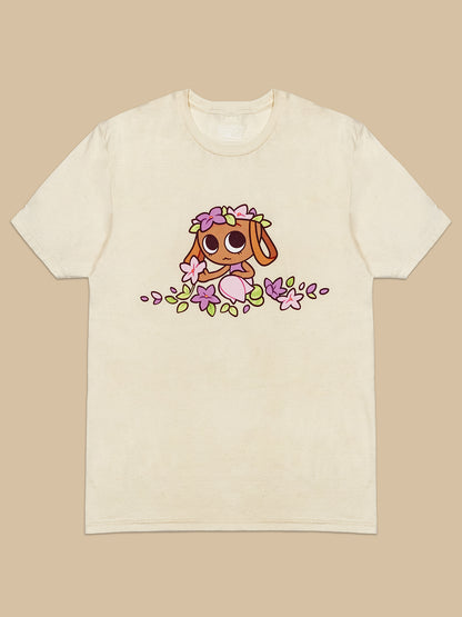 cartoon character that looks like a basket with flowers in her head and around her on a natural colored t-shirt on a beige background