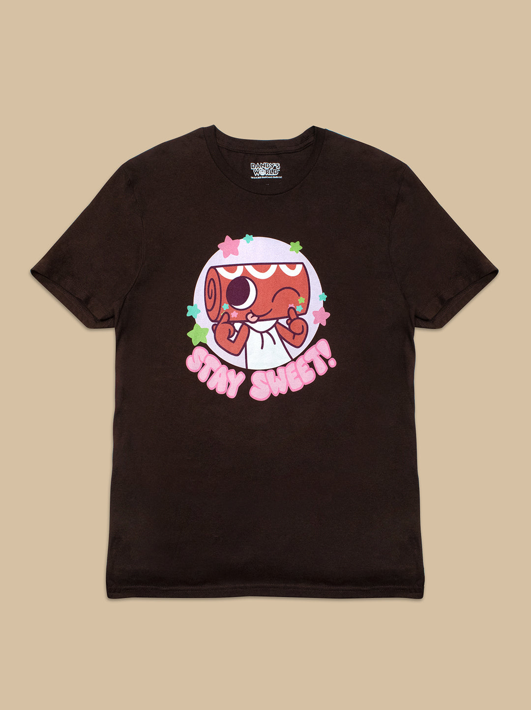 A dark brown short-sleeve t-shirt with a colorful graphic of a cartoon character and the text 'IT'S MY SWEET!' on the front, displayed flat against a solid beige background.