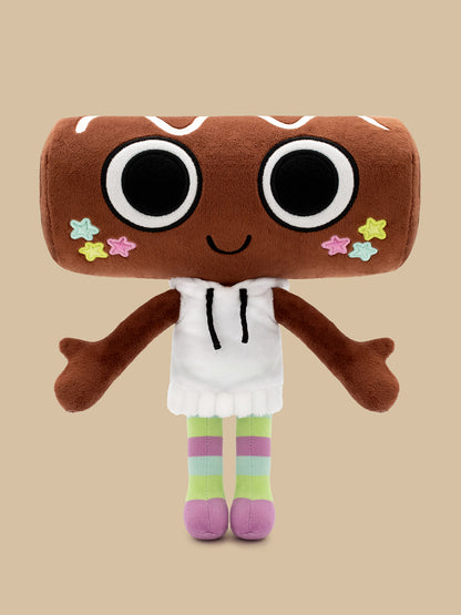 A plush toy shaped like a brown donut with large cartoon eyes, a smiling mouth, colorful star accents on the cheeks, a white hoodie, and striped green, purple, and pink legs, centered on a solid beige background.