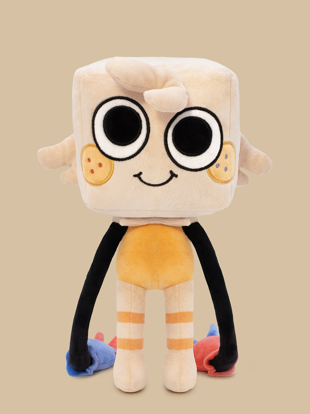 A cute, blocky plush toy character with a cream-colored square head, large cartoon eyes, a smiling face, black arms, and orange-striped legs, set against a solid beige background.