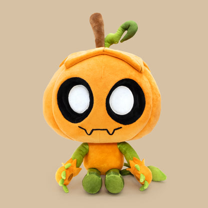 Plush toy resembling a cartoon character with an orange body and green limbs on a beige background