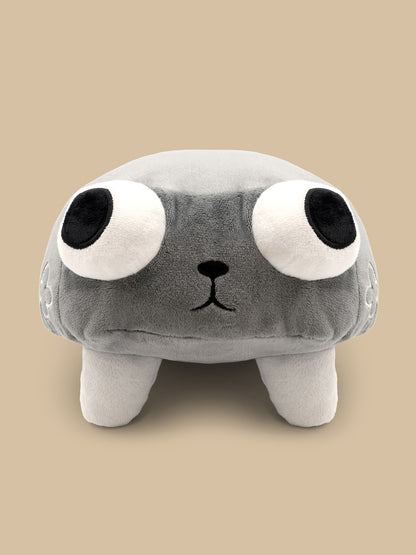 Plush toy with a gray body, black eyes, and a small black nose on a beige background