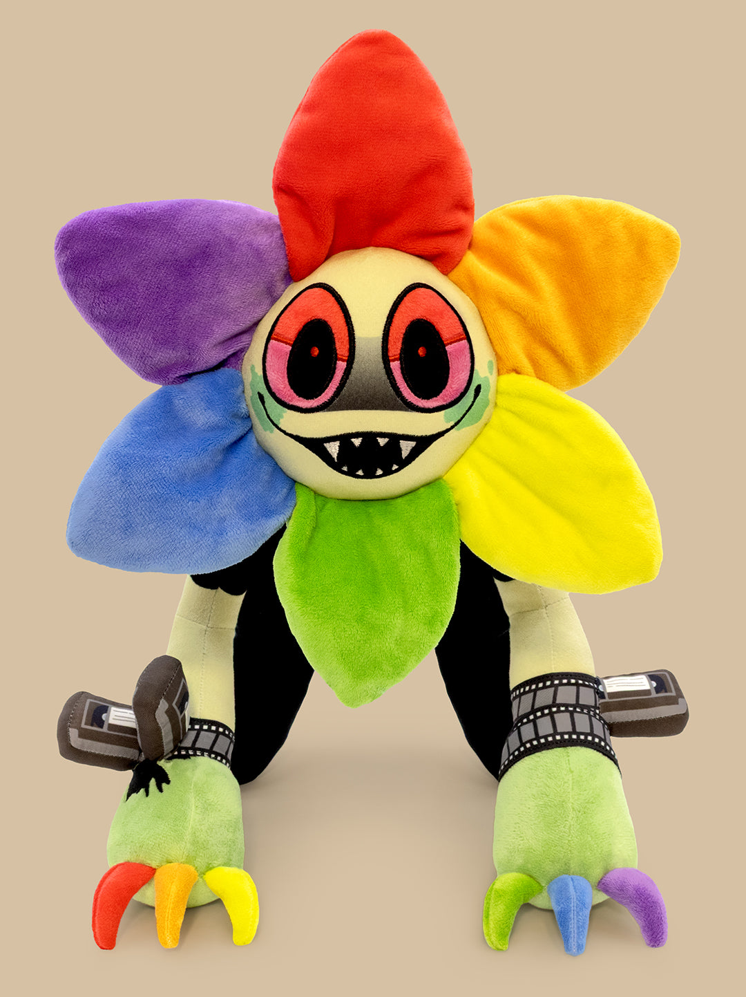 Colorful plush toy with a cartoonish design on a beige background