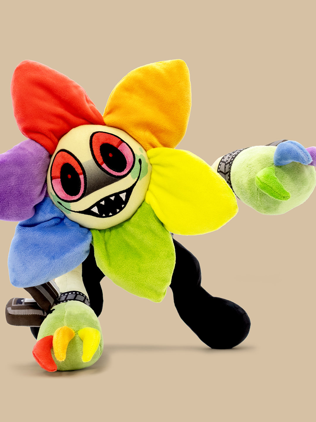 Colorful plush toy with a flower-like design on a beige background